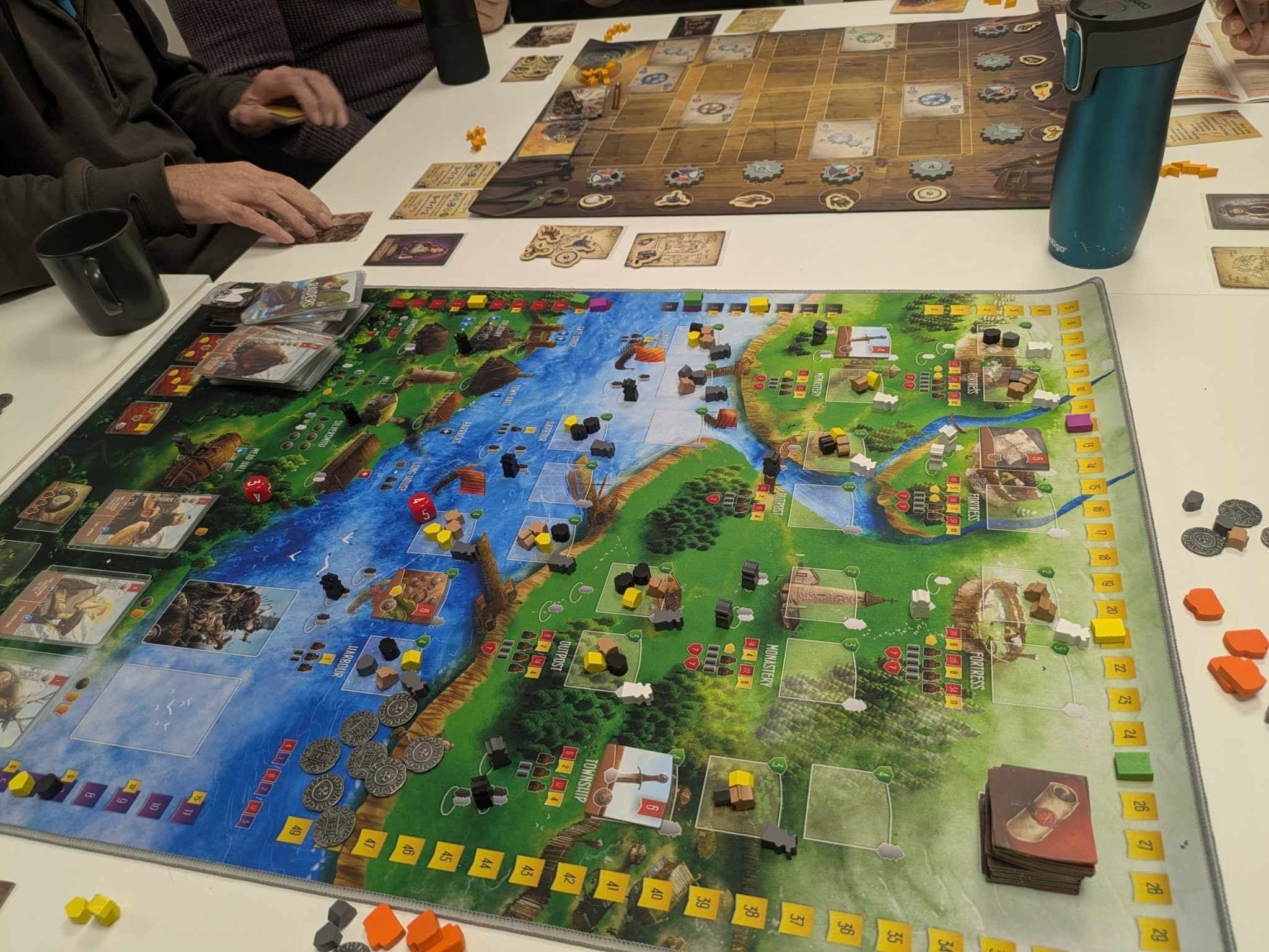 A detailed board game map with pieces in play.